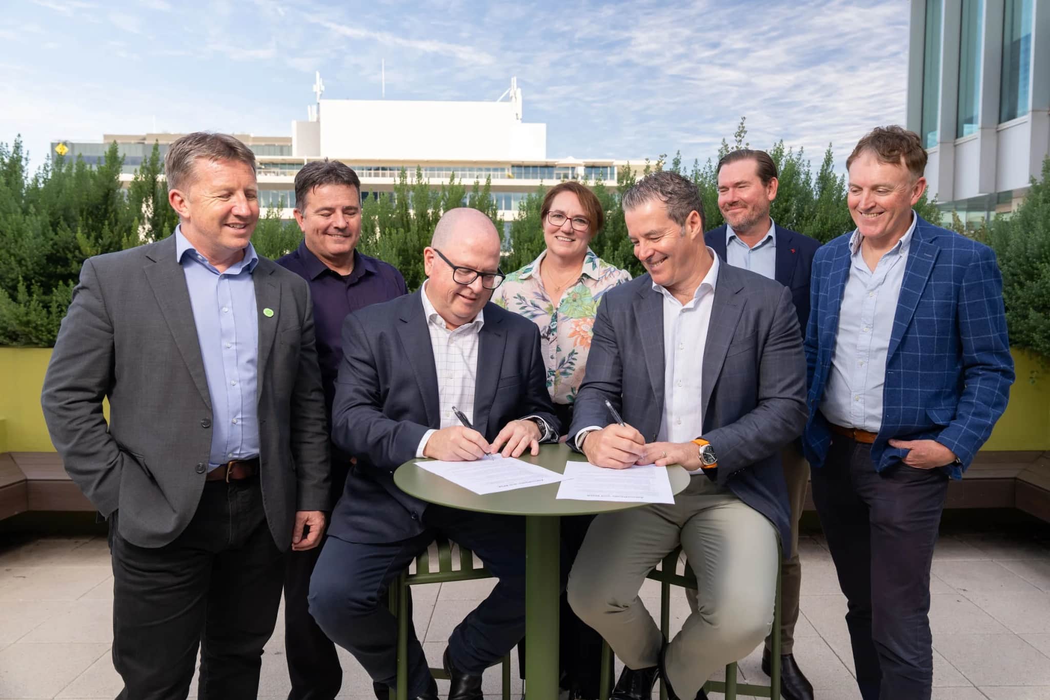 Representatives of AtkinsRéalis and WGA signing the agreement, with members of both leadership teams looking on