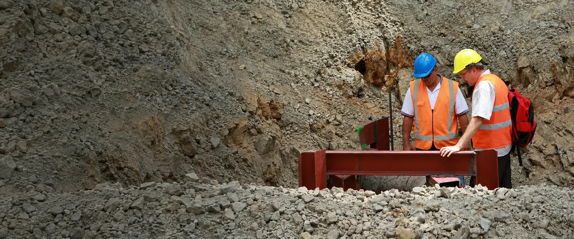 LDE engineers reviewing steelwork in an excavation on a water supply pipeline project