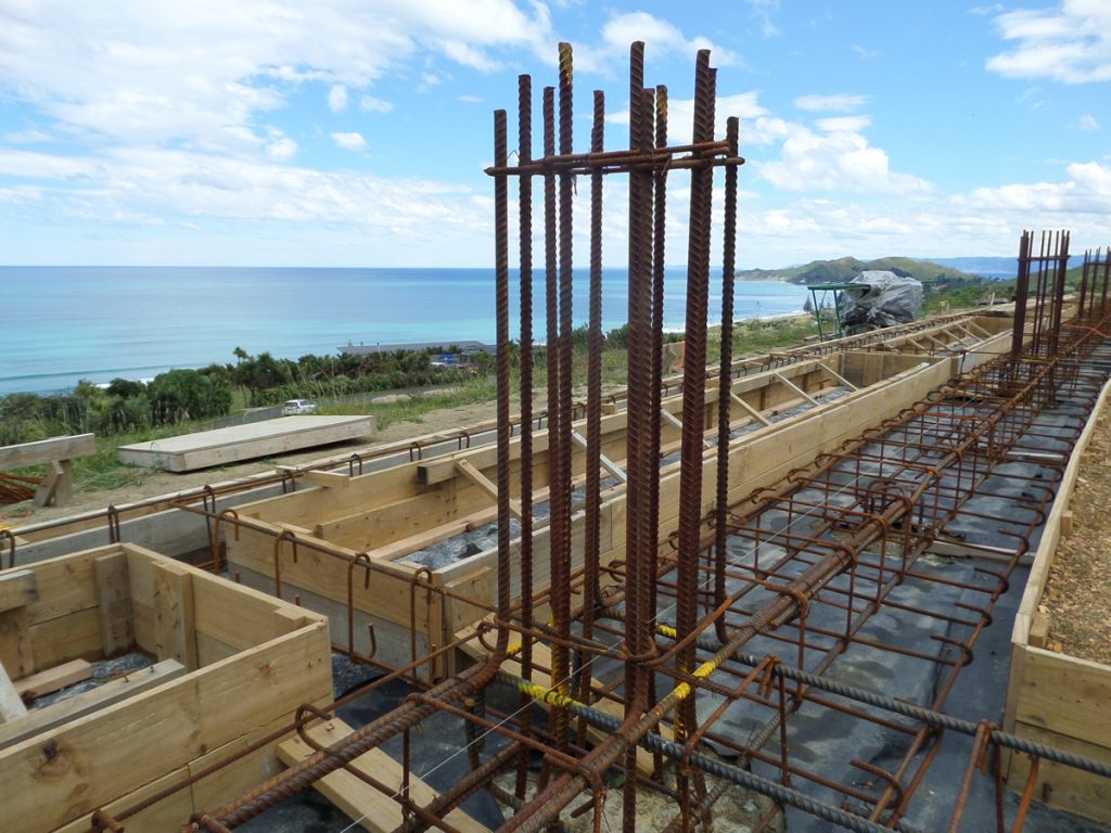 A construction site with structural steel and wood