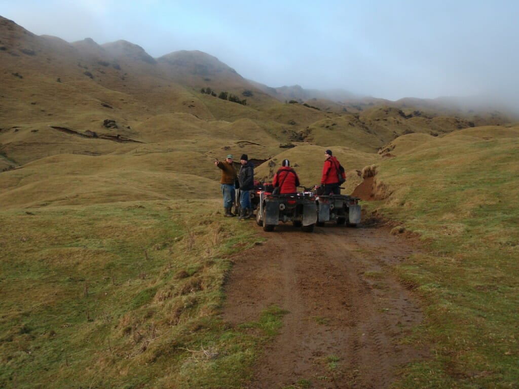 a group of people on a dirt road at Maungaharuru